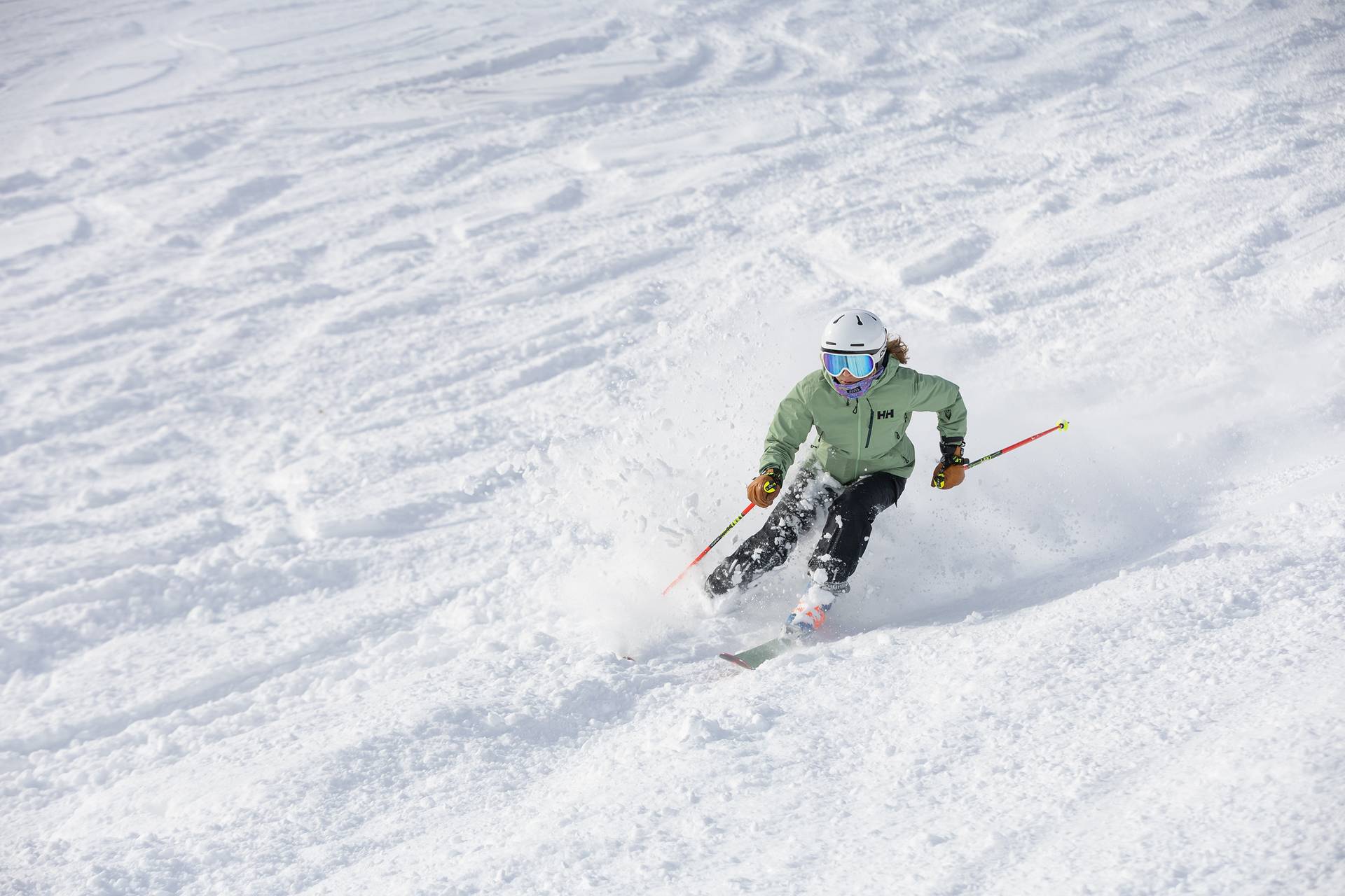 A woman skiing in powder