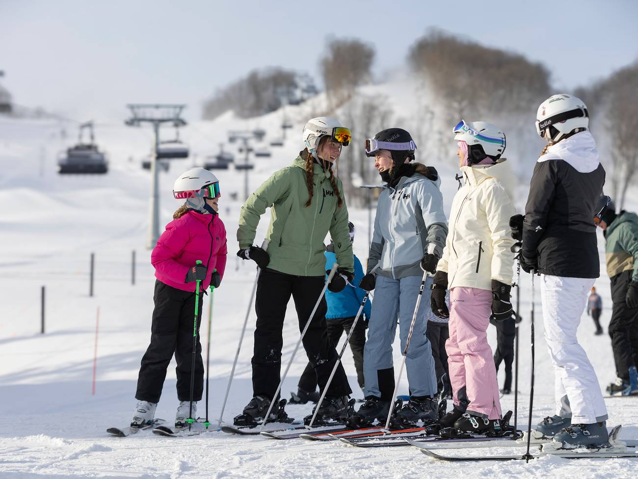 Children in ski gear posing and smiling