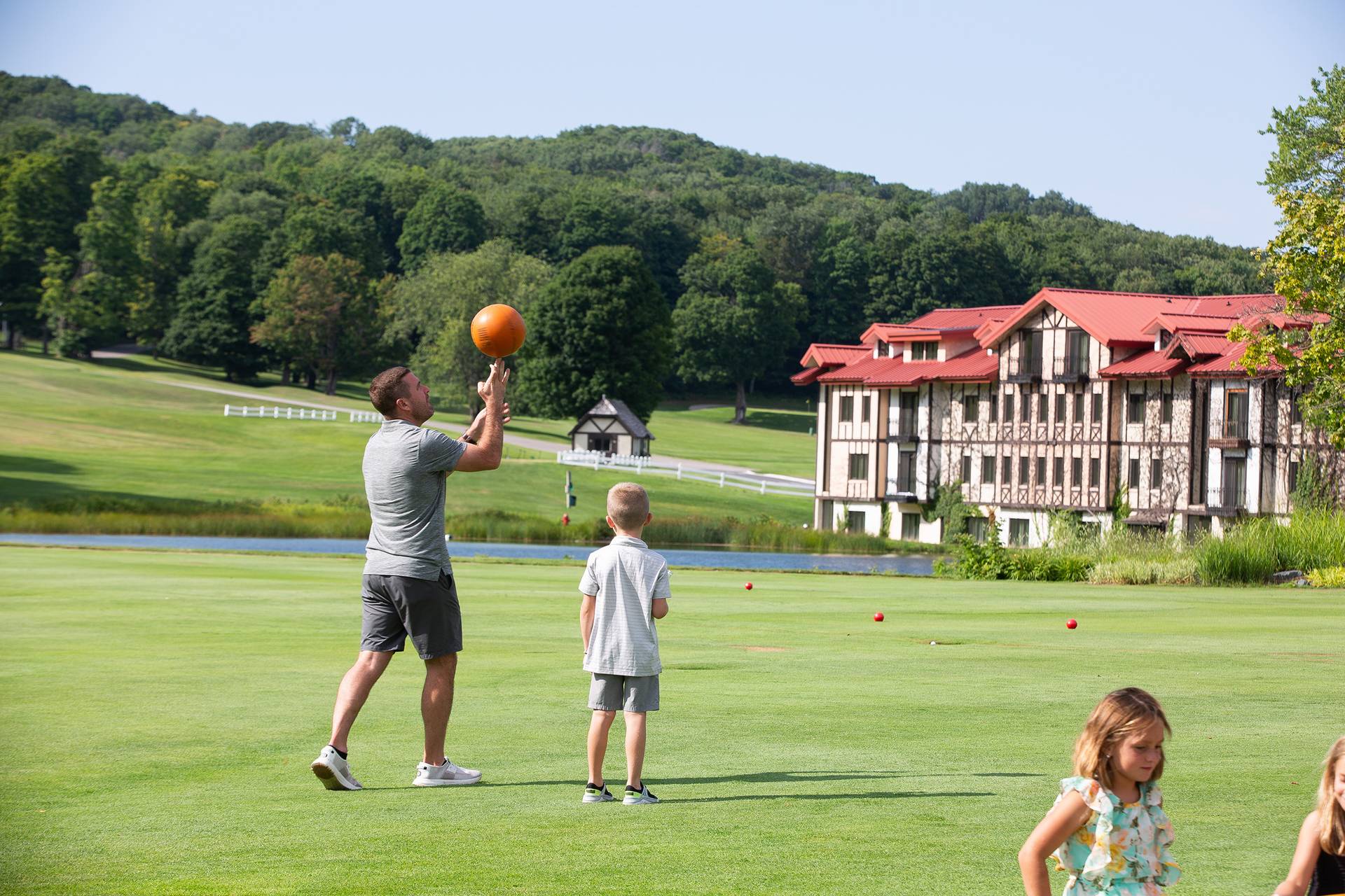 A family playing yard games at The Highlands