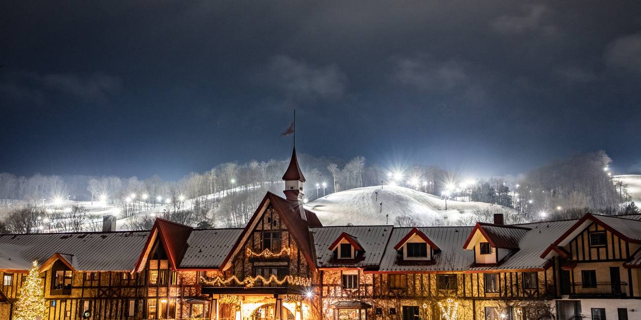 The Highlands Main Lodge in winter at night