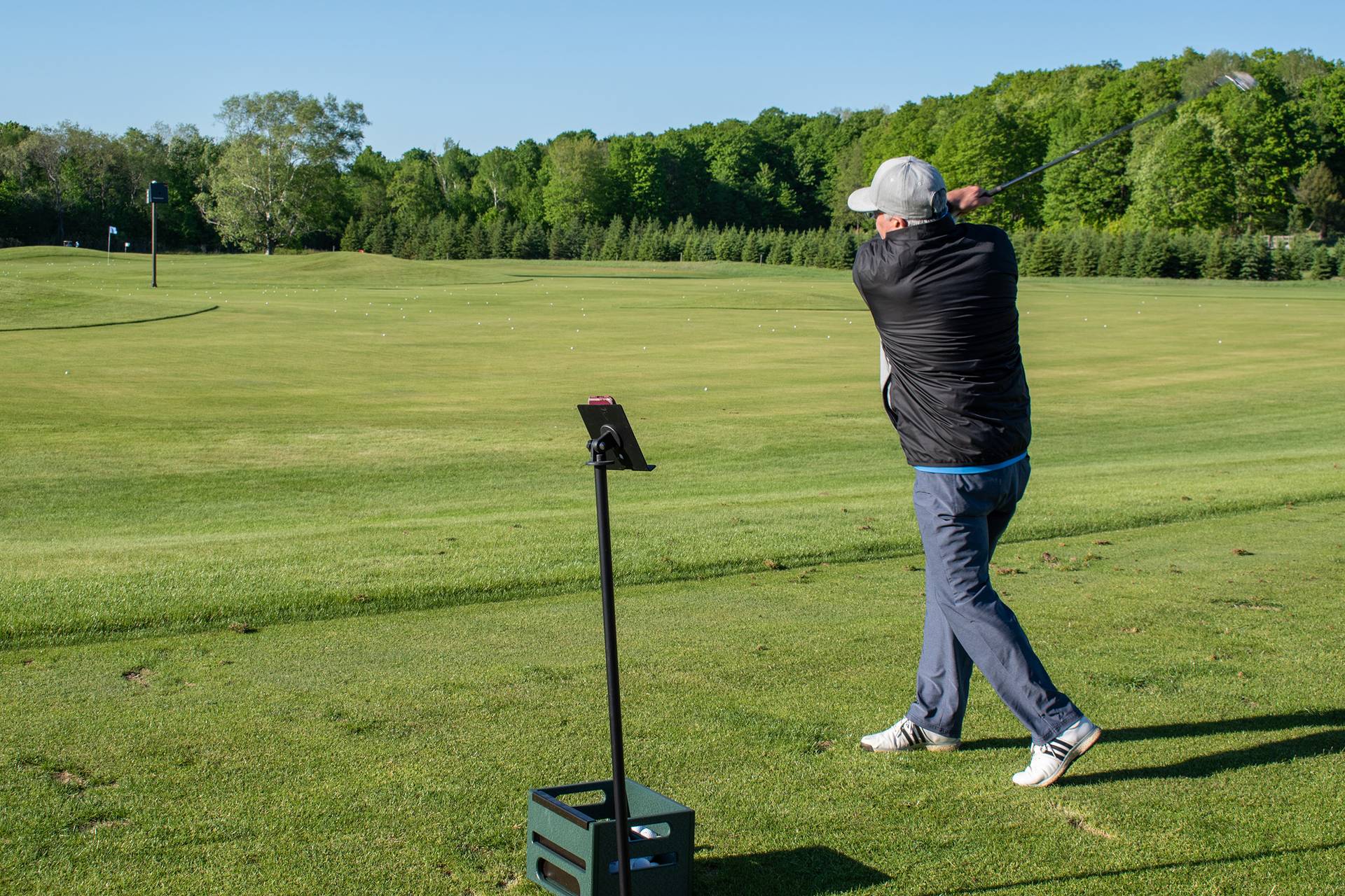 A man on the TrackMan Range