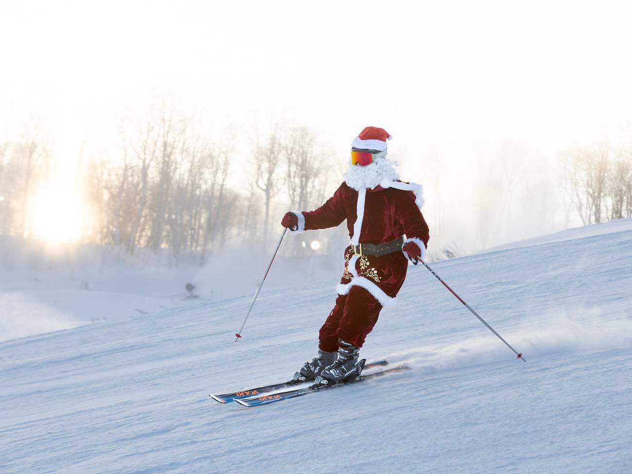 A skier dressed in a Santa suit