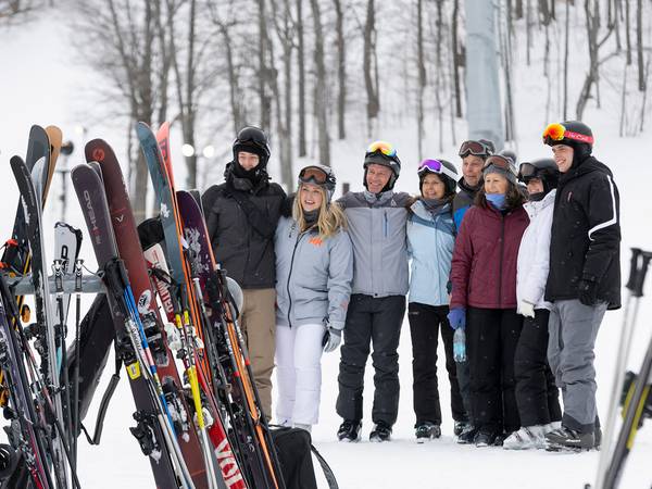 A group of people in snow gear posing